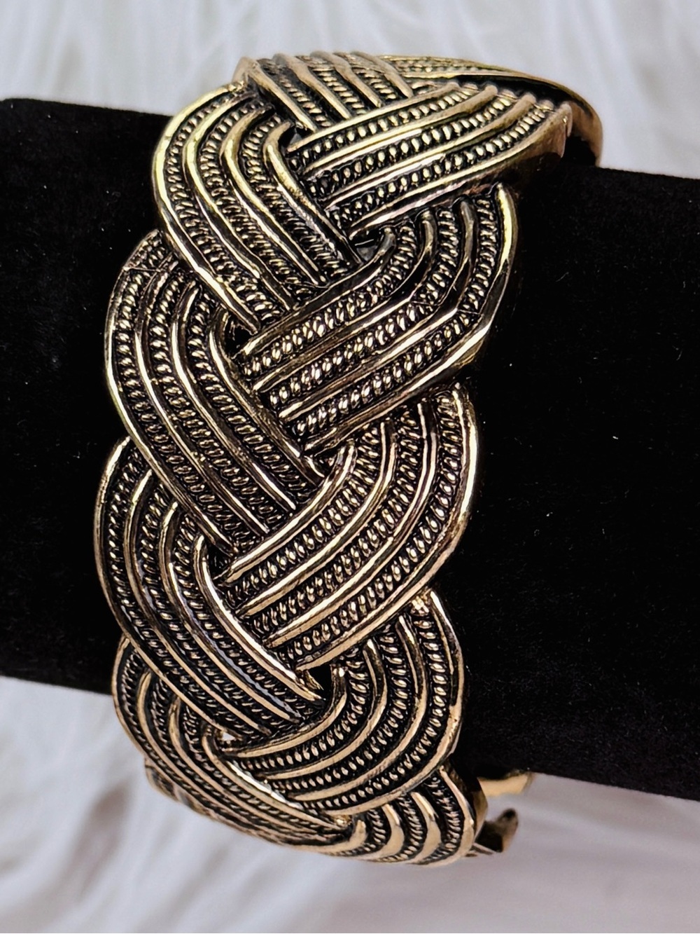 Vintage brass tone, weighted, braided design, hinged bracelet